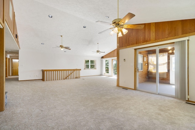 170 Sundance Rd, Cape Fair, MO 65624 - spare room featuring wood walls, a ceiling fan, light carpet, and lofted ceiling