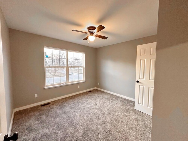 1712 S Jackson St, El Dorado Springs, MO 64744 - carpeted empty room with ceiling fan and baseboards