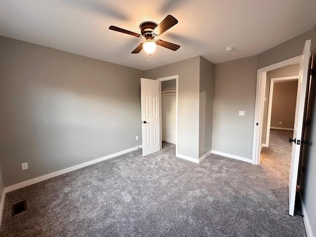 1712 S Jackson St, El Dorado Springs, MO 64744 - unfurnished bedroom featuring carpet flooring, baseboards, a ceiling fan, and a closet