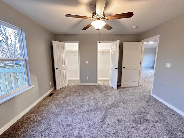 1712 S Jackson St, El Dorado Springs, MO 64744 - unfurnished bedroom with carpet, baseboards, and a ceiling fan