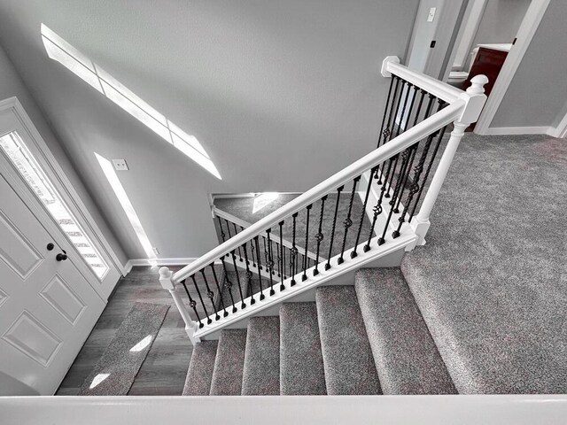 1712 S Jackson St, El Dorado Springs, MO 64744 - stairway with baseboards