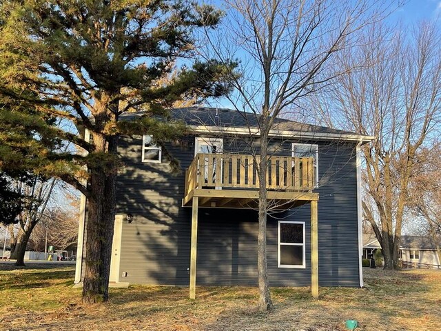1712 S Jackson St, El Dorado Springs, MO 64744 - rear view of property featuring a balcony