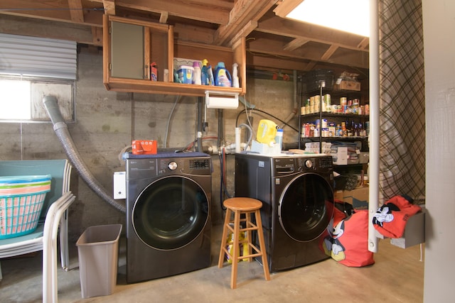 laundry area featuring washing machine and clothes dryer