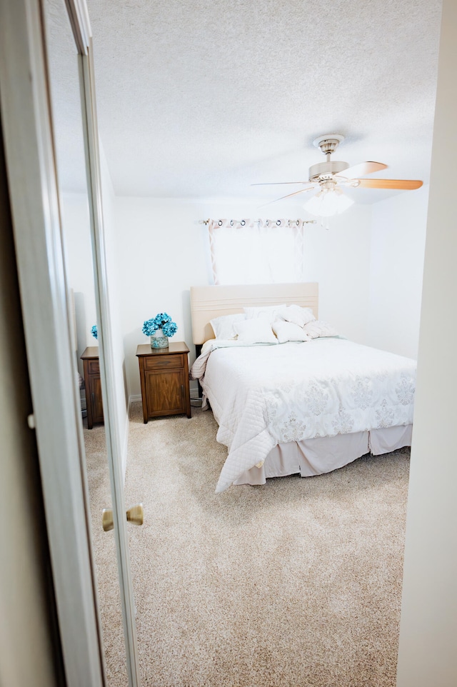 21246 County Road 295, Hermitage, MO 65668 - carpeted bedroom with a textured ceiling and a ceiling fan
