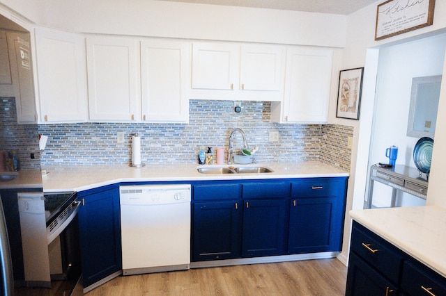 21246 County Road 295, Hermitage, MO 65668 - kitchen featuring white dishwasher, blue cabinets, a sink, and range with electric cooktop