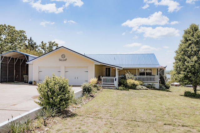 21246 County Road 295, Hermitage, MO 65668 - ranch-style house featuring covered porch, a front lawn, an attached garage, concrete driveway, and a detached carport