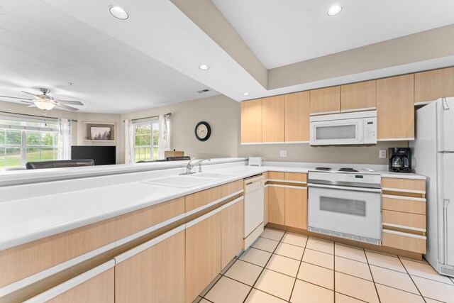 351 S Wildwood Dr Unit 3-2, Branson, MO 65616 - kitchen with white appliances, a sink, light countertops, light brown cabinets, and recessed lighting