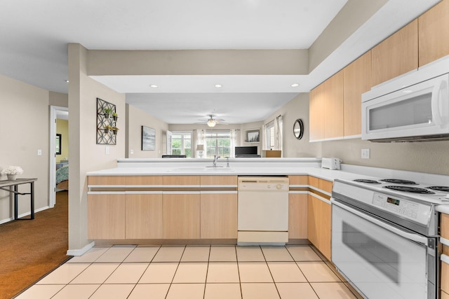 351 S Wildwood Dr Unit 3-2, Branson, MO 65616 - kitchen featuring white appliances, a sink, light countertops, light brown cabinetry, and recessed lighting