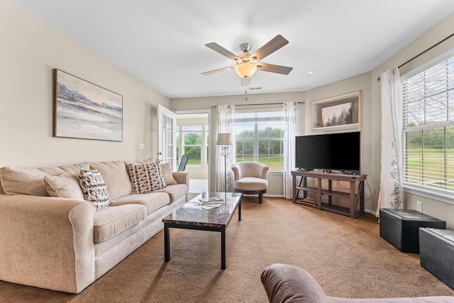 351 S Wildwood Dr Unit 3-2, Branson, MO 65616 - living area with healthy amount of natural light, ceiling fan, carpet flooring, and baseboards