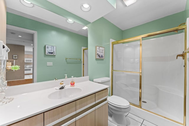 351 S Wildwood Dr Unit 3-2, Branson, MO 65616 - bathroom with a stall shower, toilet, tile patterned flooring, and vanity