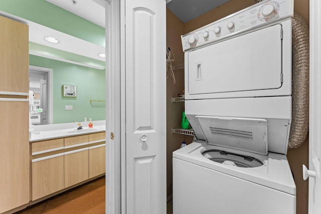 351 S Wildwood Dr Unit 3-2, Branson, MO 65616 - laundry room featuring stacked washer and clothes dryer and recessed lighting