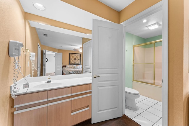 351 S Wildwood Dr Unit 3-2, Branson, MO 65616 - ensuite bathroom featuring toilet, tile patterned floors, ceiling fan, vanity, and bath / shower combo with glass door
