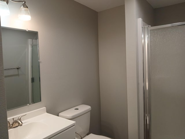 639 W Webster St, Springfield, MO 65802 - bathroom with a stall shower, toilet, and vanity