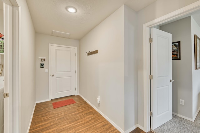 358 W Granada St, Republic, MO 65738 - entryway with baseboards, a textured ceiling, and wood finished floors
