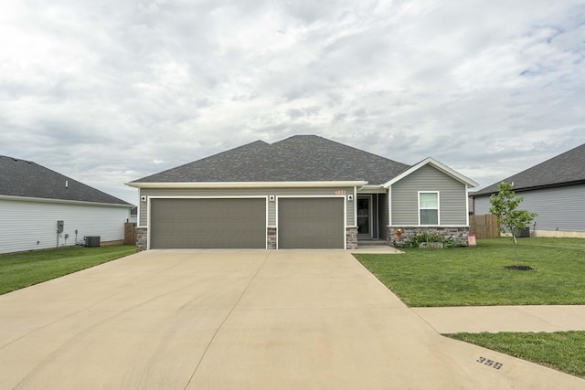 358 W Granada St, Republic, MO 65738 - view of front of home featuring an attached garage, stone siding, a front lawn, and driveway