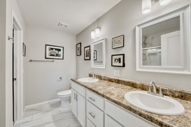 358 W Granada St, Republic, MO 65738 - bathroom with marble finish floors, toilet, double vanity, a shower, and baseboards