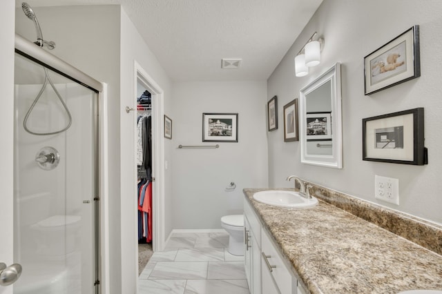 358 W Granada St, Republic, MO 65738 - bathroom with toilet, a shower stall, marble finish flooring, vanity, and a walk in closet