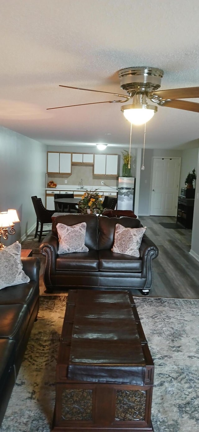 95 Starboard Dr, Kimberling City, MO 65686 - living area with a ceiling fan, baseboards, a textured ceiling, and carpet flooring
