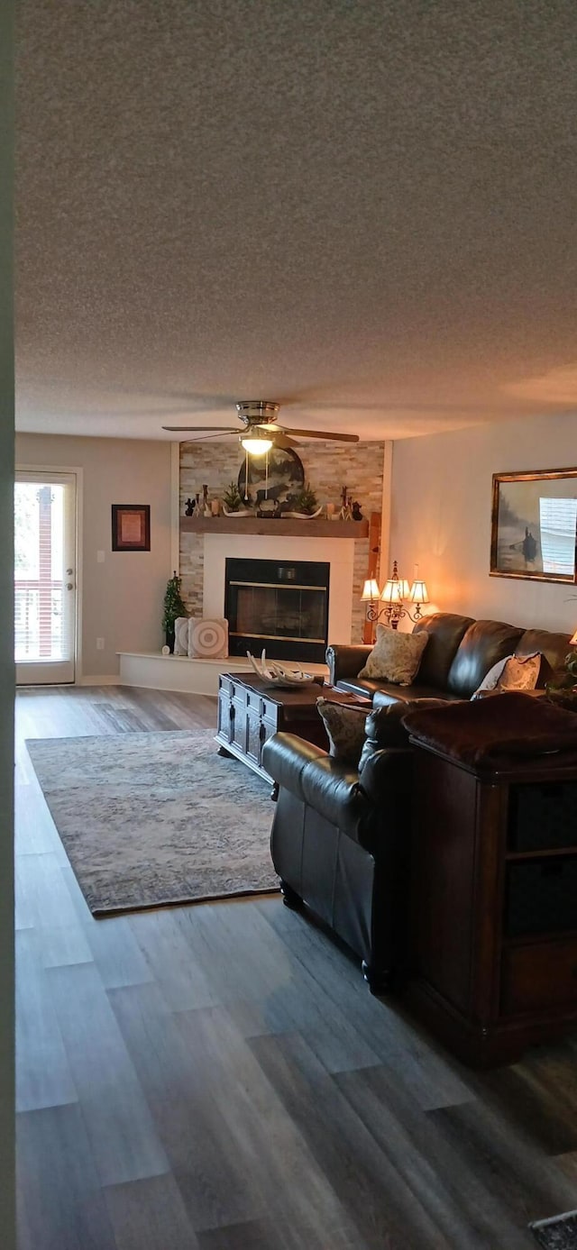 95 Starboard Dr, Kimberling City, MO 65686 - living room featuring a textured ceiling, wood finished floors, and a fireplace