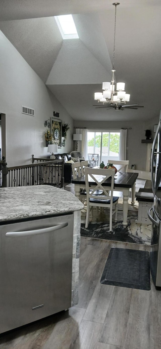 95 Starboard Dr, Kimberling City, MO 65686 - kitchen with stainless steel appliances, a chandelier, lofted ceiling, light countertops, and wood finished floors