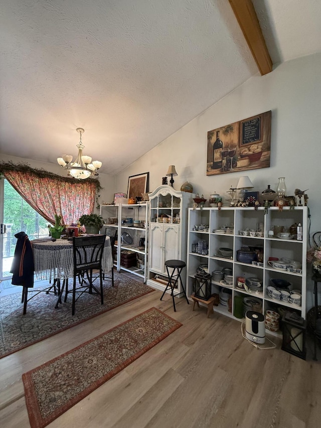 310 Mulling Dr, Highlandville, MO 65669 - dining area featuring wood finished floors, a chandelier, and a textured ceiling