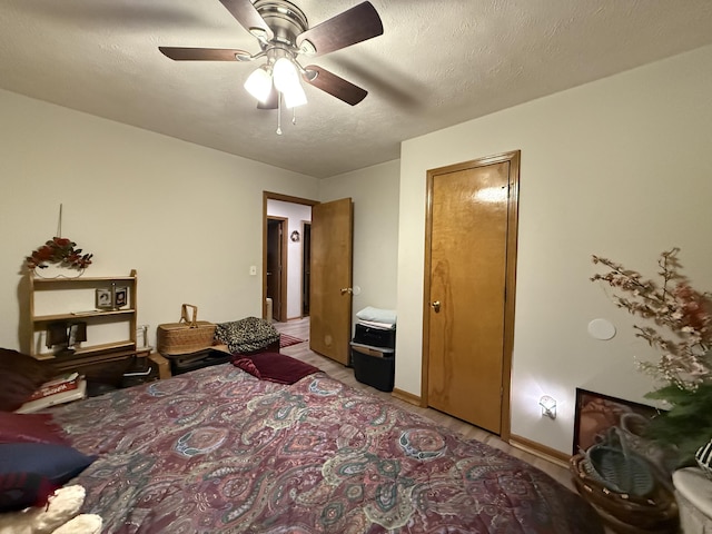 310 Mulling Dr, Highlandville, MO 65669 - bedroom featuring a textured ceiling, ceiling fan, and baseboards