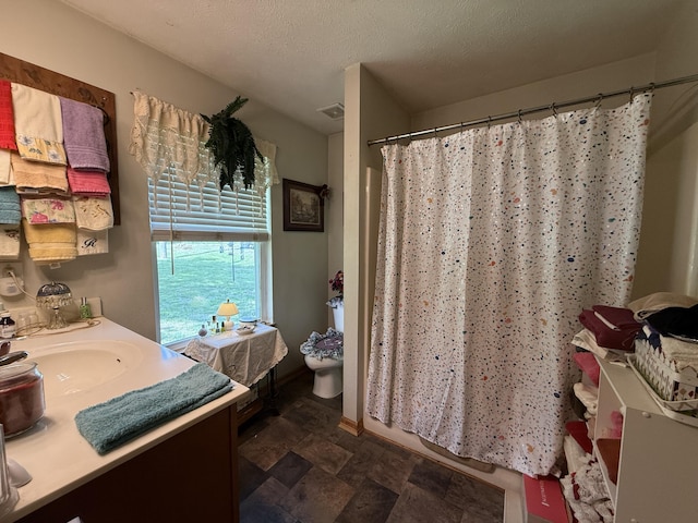 310 Mulling Dr, Highlandville, MO 65669 - bathroom featuring stone finish floors, a shower with curtain, vanity, baseboards, and toilet