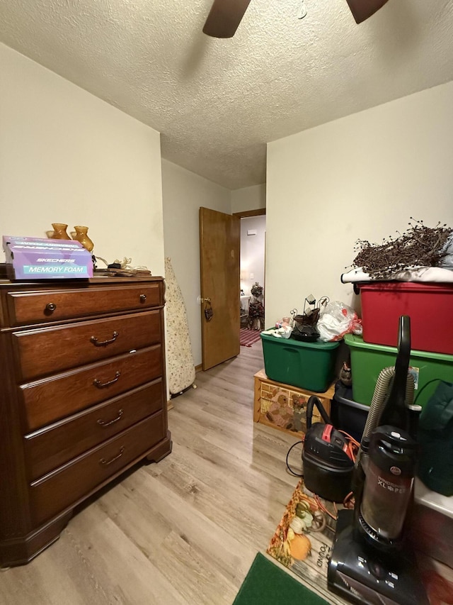 310 Mulling Dr, Highlandville, MO 65669 - bedroom with light wood finished floors, a textured ceiling, and ceiling fan