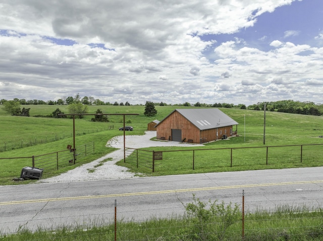 view of road featuring a view of countryside and an outbuilding