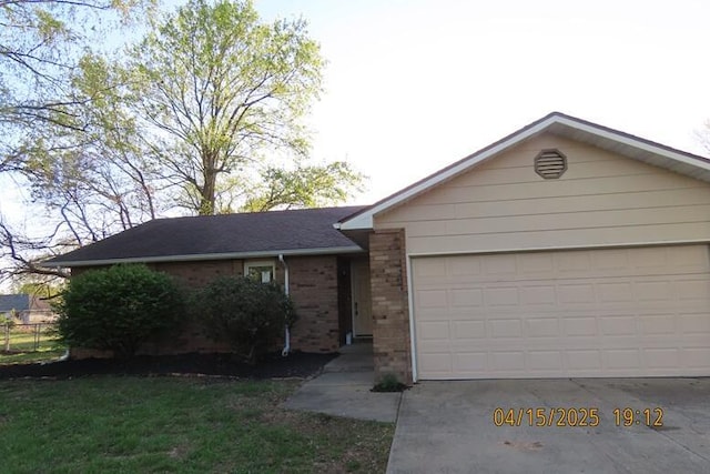 127 Grand Prairie Dr, Willard, MO 65781 - ranch-style house with an attached garage, brick siding, and concrete driveway