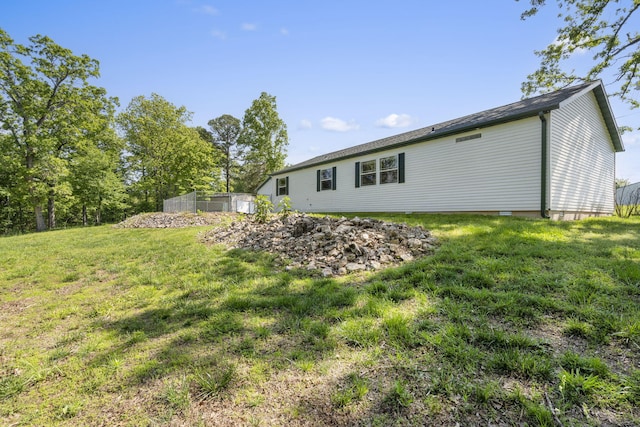 rear view of property with a lawn