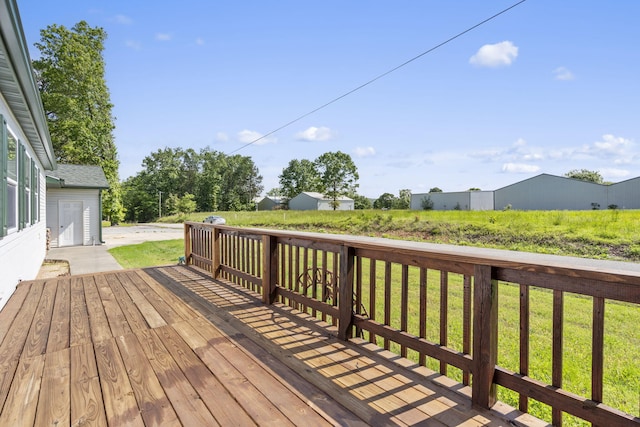 wooden terrace featuring a lawn