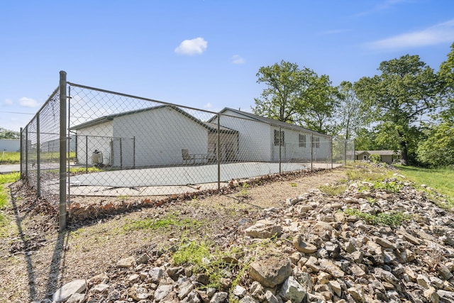 view of home's exterior with fence