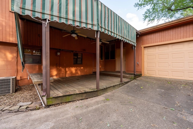 view of property exterior featuring ceiling fan, central AC unit, and an attached garage