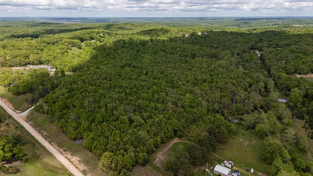 drone / aerial view of a heavily wooded area
