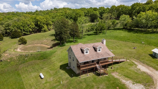 view from above of property with a forest