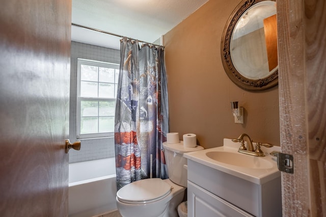 bathroom with toilet, shower / tub combo with curtain, and vanity