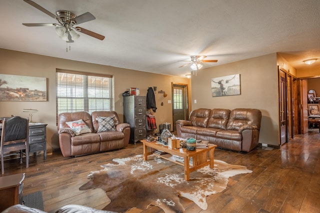 living room featuring a ceiling fan and wood-type flooring