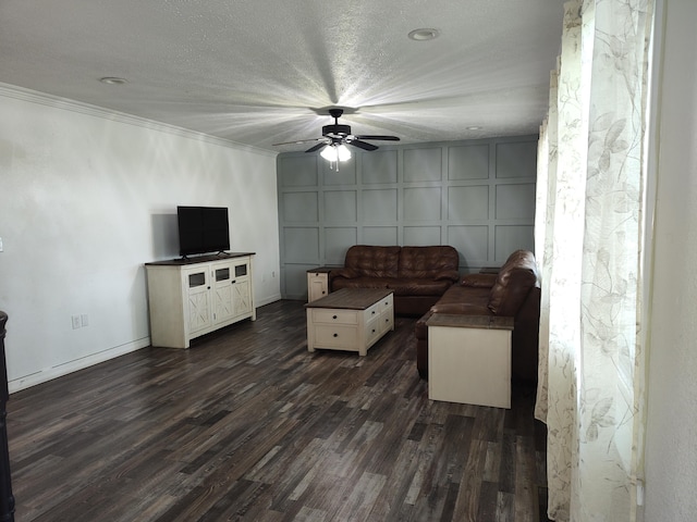 4181 S 105th Rd, Bolivar, MO 65613 - living area with a ceiling fan, dark wood-type flooring, a decorative wall, crown molding, and baseboards