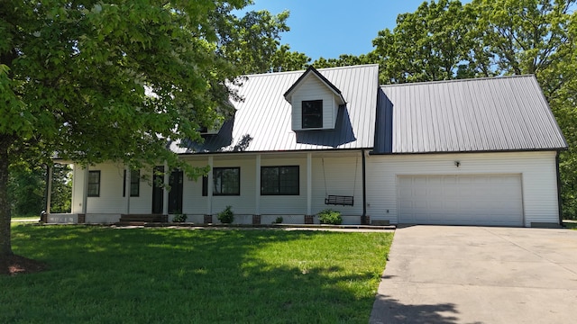 4181 S 105th Rd, Bolivar, MO 65613 - view of front of house featuring a front yard, an attached garage, metal roof, and concrete driveway