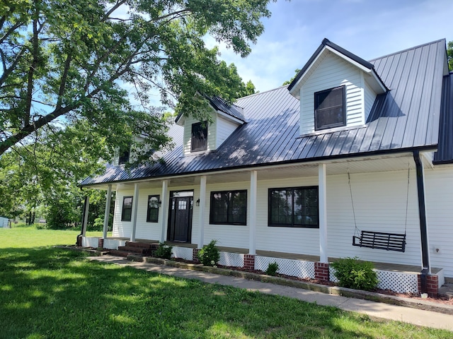 4181 S 105th Rd, Bolivar, MO 65613 - view of front of house featuring a porch, metal roof, and a front yard