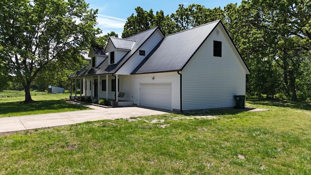 4181 S 105th Rd, Bolivar, MO 65613 - view of property exterior with an attached garage, driveway, a yard, and metal roof