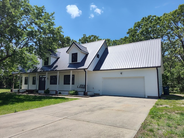 4181 S 105th Rd, Bolivar, MO 65613 - view of front of home with driveway, metal roof, a garage, and a front yard