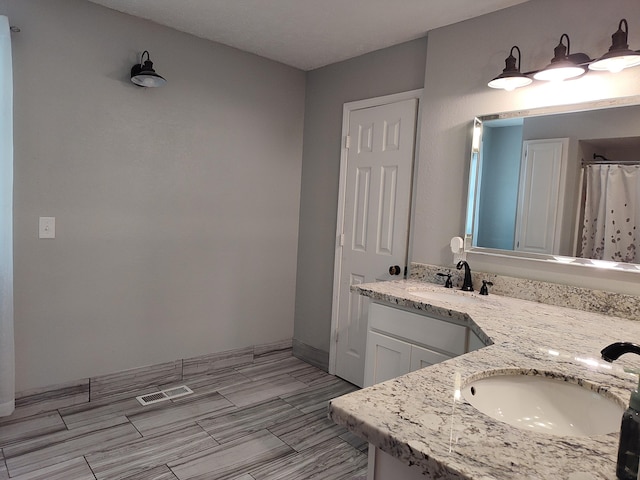 4181 S 105th Rd, Bolivar, MO 65613 - full bath featuring double vanity and a shower with shower curtain