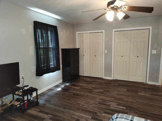 4181 S 105th Rd, Bolivar, MO 65613 - foyer entrance featuring a ceiling fan, dark wood-style flooring, baseboards, and a textured ceiling