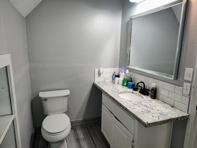 4181 S 105th Rd, Bolivar, MO 65613 - bathroom with toilet, vanity, decorative backsplash, and baseboards