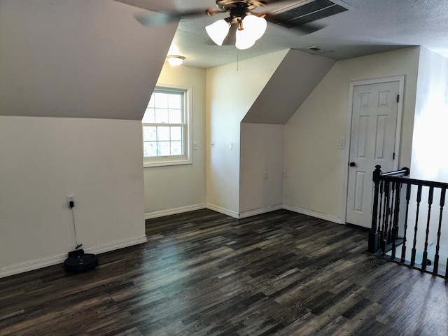 4181 S 105th Rd, Bolivar, MO 65613 - bonus room featuring a ceiling fan, dark wood finished floors, vaulted ceiling, baseboards, and a textured ceiling