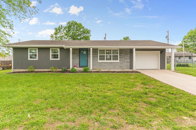 ranch-style house featuring an attached garage and driveway