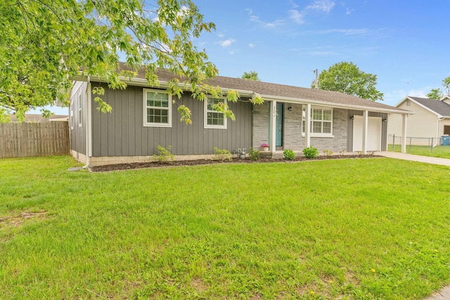 ranch-style house with an attached garage and driveway