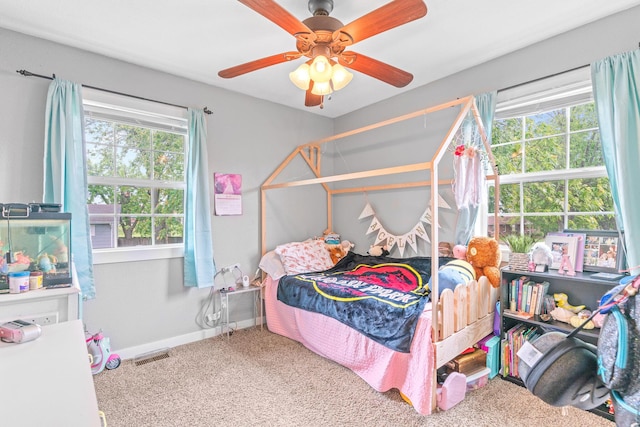 bedroom with carpet flooring, baseboards, and a ceiling fan